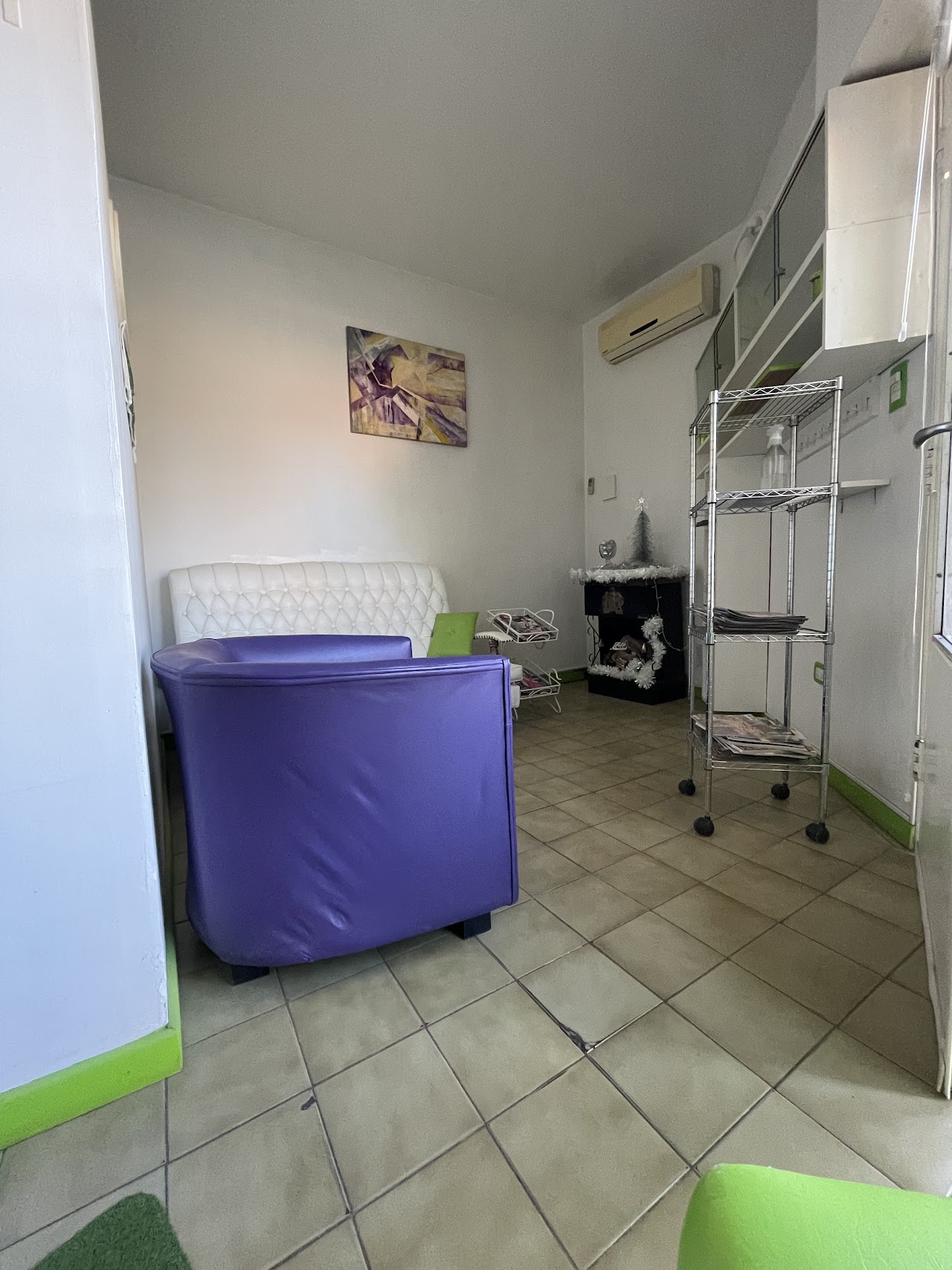 Sophisticated luxury nail salon manicure station. Professional nail technician applying elegant natural nude gel nail polish with delicate botanical art. Minimalist aesthetic, marble tabletop, soft natural lighting, high end wellness spa photography.